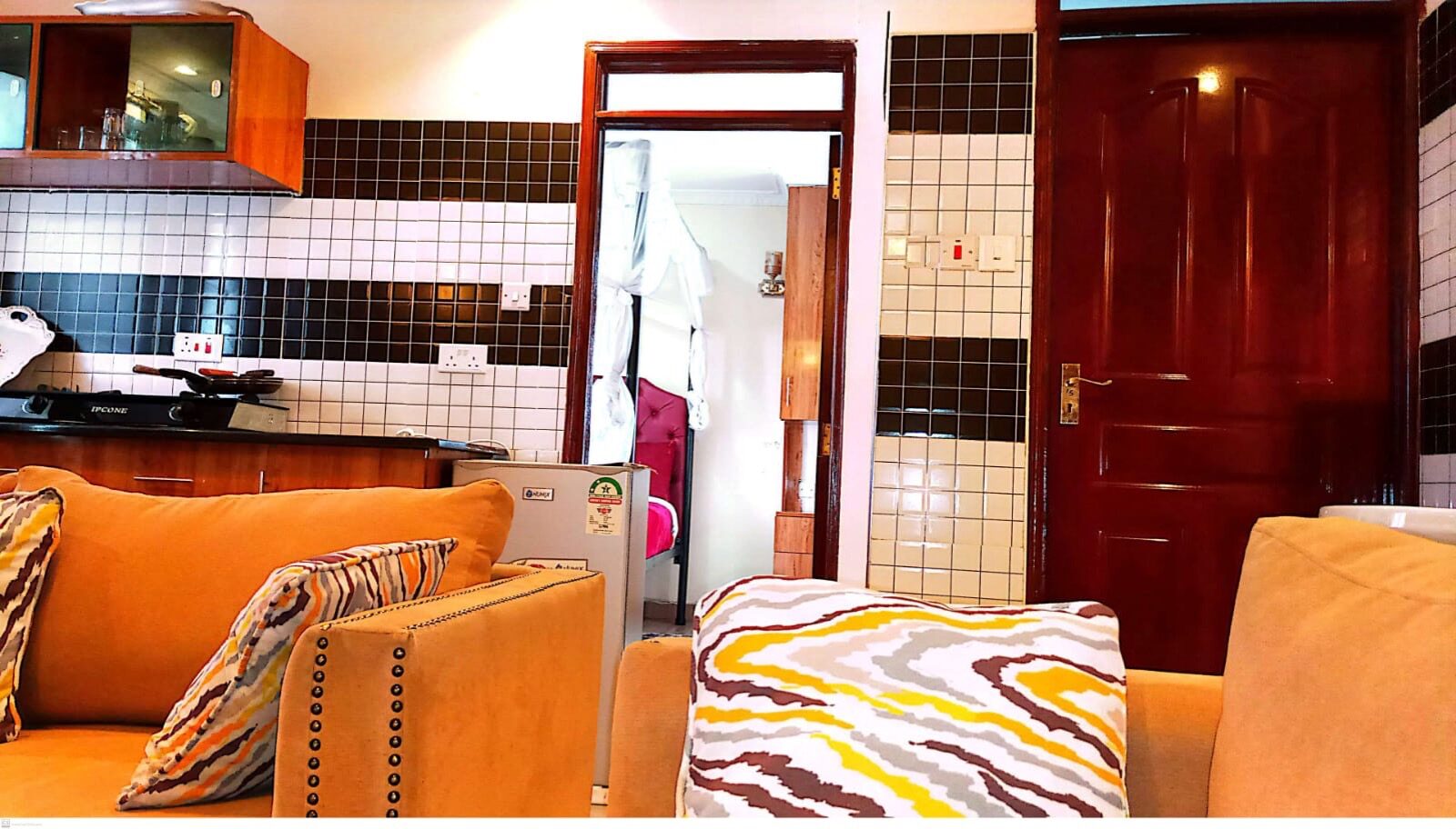 Studio apartment living area and kitchenette at Toque Hotel Nairobi