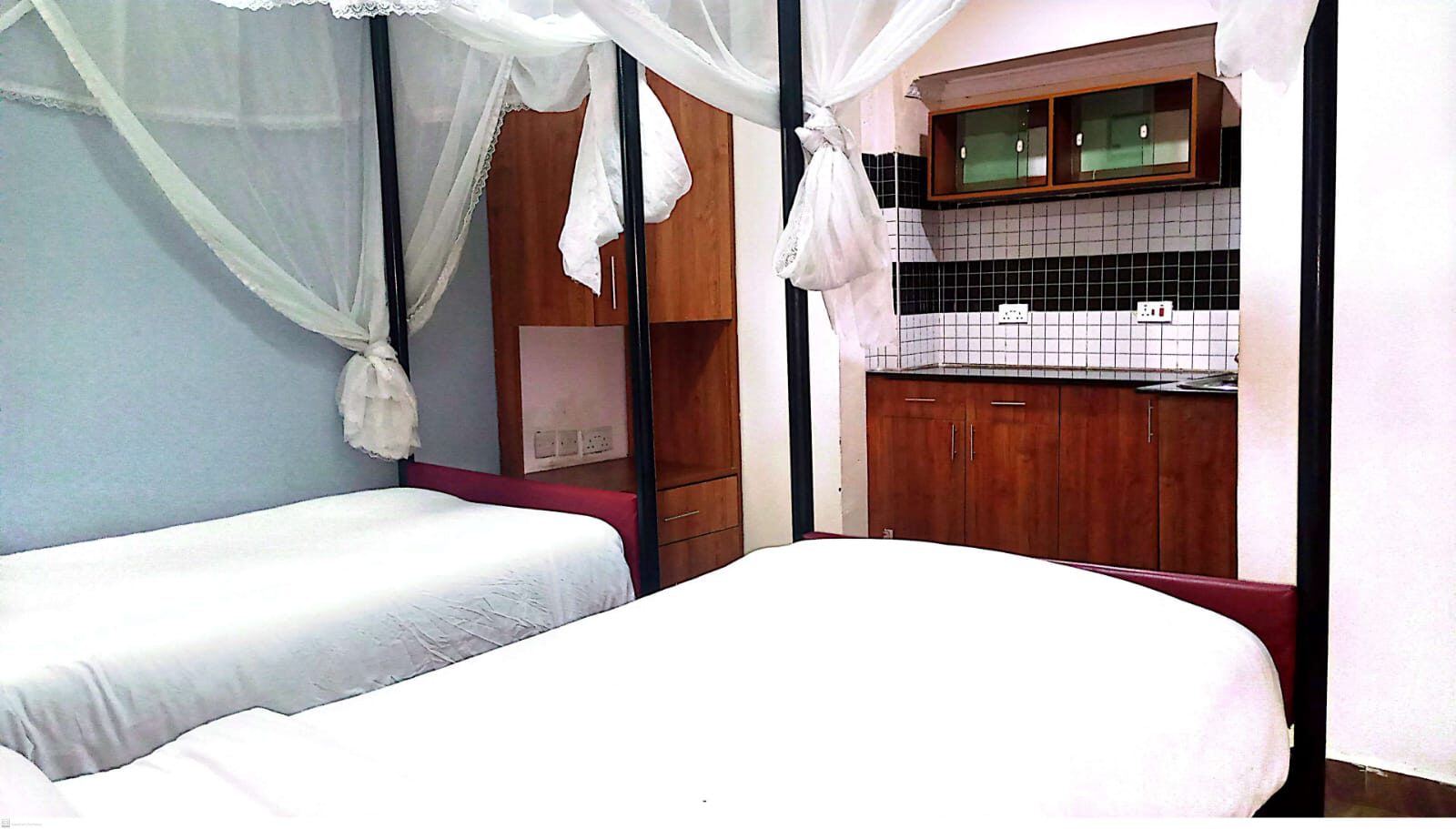 Twin beds with mosquito nets and kitchenette Nairobi Airbnb